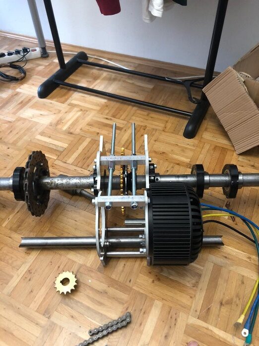 The BLDC motor, rear axle and chain drive during assembly