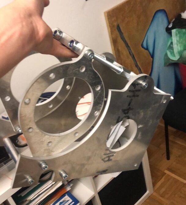 A custom waterjet-cut aluminium motor mount plate